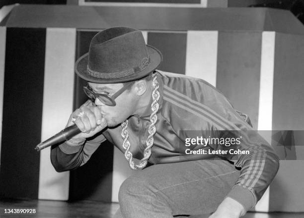 American rapper Darryl McDaniels, aka DMC, of the American hip hop group RUN-DMC, sings on stage during a concert circa June, 1987 at the Greek...