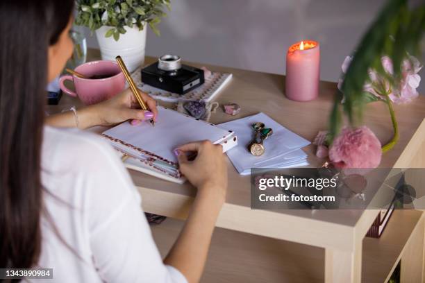 copy space shot of young woman writing friend's address on an envelope - writing copy stock pictures, royalty-free photos & images