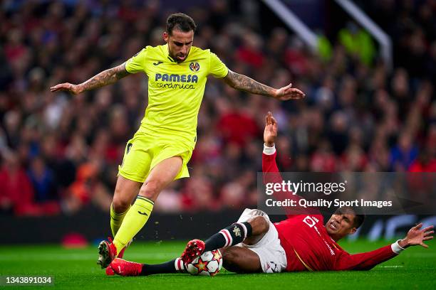 Paco Alcacer of Manchester United competes for the ball with Raphael Varane of Villarreal CF during the UEFA Champions League group F match between...