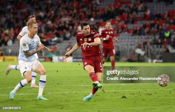Robert Lewandowski of FC Bayern Muenchen scores their side's second goal during the UEFA Champions League group E match between FC Bayern München and...
