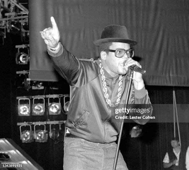 American rapper Darryl McDaniels, aka DMC, of the American hip hop group RUN-DMC, sings on stage during a concert circa June, 1987 at the Greek...