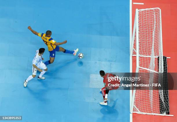 Ferrao of Brazil scores their side's first goal past Nicolas Sarmiento of Argentina during the FIFA Futsal World Cup 2021 Semi-Final match between...