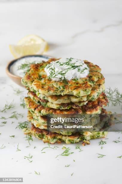 greek zucchini and feta fritters - courgette stock pictures, royalty-free photos & images