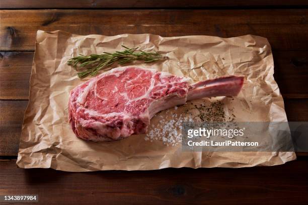 the king of steaks "the tomahawk" - roast beef dinner stock pictures, royalty-free photos & images