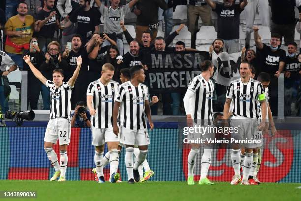 Federico Chiesa of Juventus celebrates with team mates after scoring their side's first goal during the UEFA Champions League group H match between...