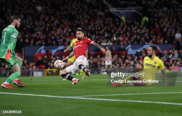 Paco Alcacer of Villarreal CF scores their side's first goal past David De Gea of Manchester United during the UEFA Champions League group F match...