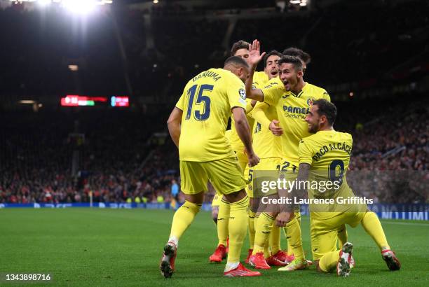 Paco Alcacer of Villarreal CF celebrates with Arnaut Danjuma and Yeremi Pino after scoring their side's first goal during the UEFA Champions League...