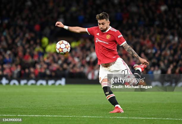 Alex Telles of Manchester United scores their side's first goal during the UEFA Champions League group F match between Manchester United and...