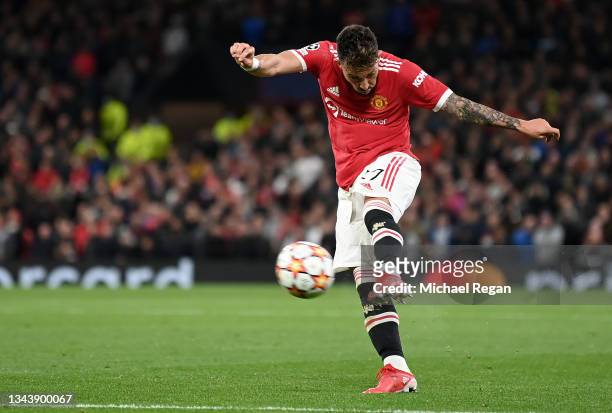 Alex Telles of Manchester United scores their side's first goal during the UEFA Champions League group F match between Manchester United and...