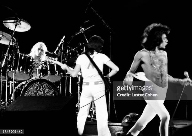 English musician, singer-songwriter and multi-instrumentalist Roger Taylor, English bassist John Deacon and British singer, songwriter, record...
