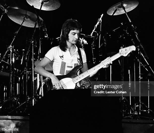 English bassist John Deacon, of the British rock band Queen, perform on stage circa 1980's in Los Angeles, California.