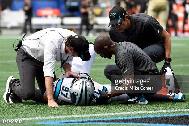 Medical staff attend to defensive end Yetur Gross-Matos of the Carolina Panthers during the Panthers' football game against the New Orleans Saints at...