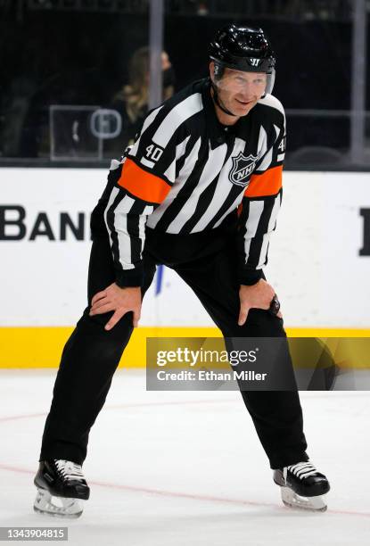 Referee Steve Kozari smiles in the second period of a preseason game between the Colorado Avalanche and the Vegas Golden Knights at T-Mobile Arena on...