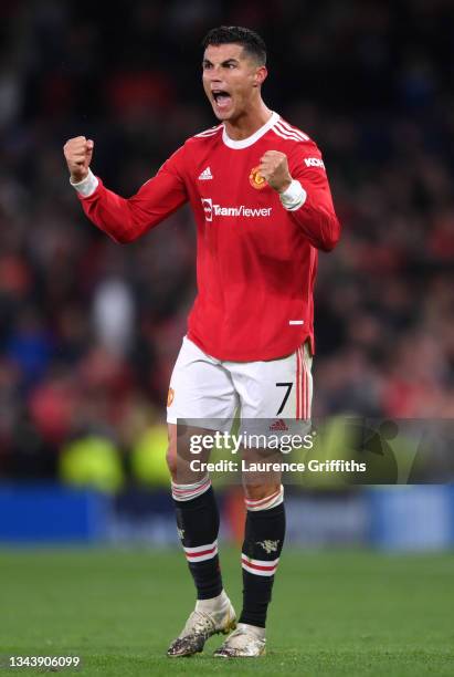 Cristiano Ronaldo of Manchester United celebrates their side's victory after the UEFA Champions League group F match between Manchester United and...