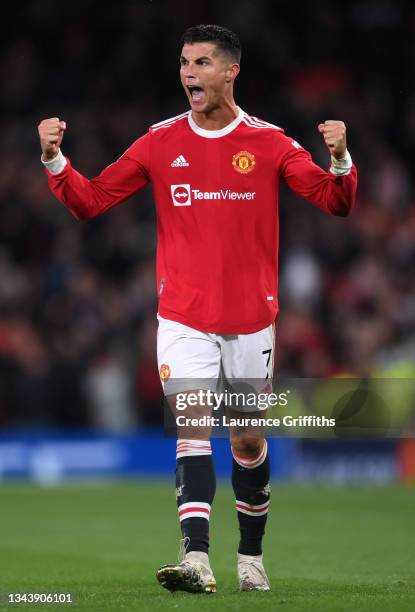 Cristiano Ronaldo of Manchester United celebrates their side's victory after the UEFA Champions League group F match between Manchester United and...