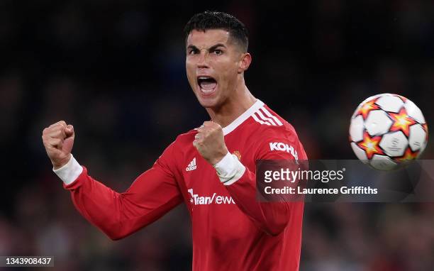 Cristiano Ronaldo of Manchester United celebrates their side's victory after the UEFA Champions League group F match between Manchester United and...