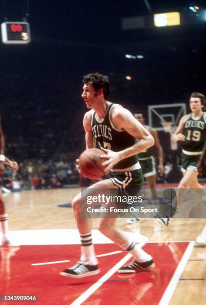 John Havlicek of the Boston Celtics drives to the basket against the Washington Bullets during an NBA basketball game circa 1975 at the Capital...