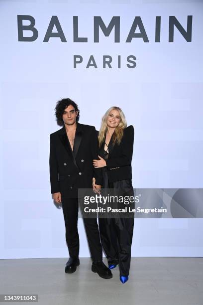 Etienne Baret and Camille Razat attend the Balmain Festival as part of Paris Fashion Week Womenswear Spring/Summer 2022 at La Seine Musicale on...