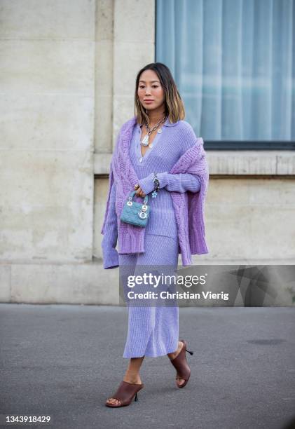 Aimee Song seen wearing Dior bag, lavender skirt and jumper, knitted jumper outside Acne during Paris Fashion Week - Womenswear Spring Summer 2022 on...