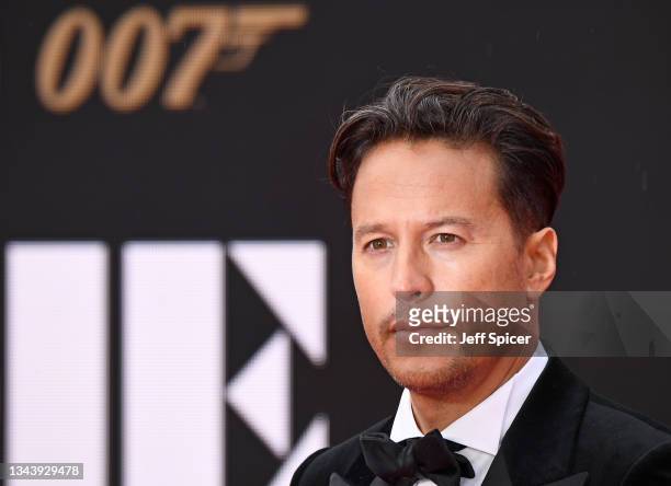 Director and Screenplay writer Cary Joji Fukunaga attends the World Premiere of "NO TIME TO DIE" at the Royal Albert Hall on September 28, 2021 in...