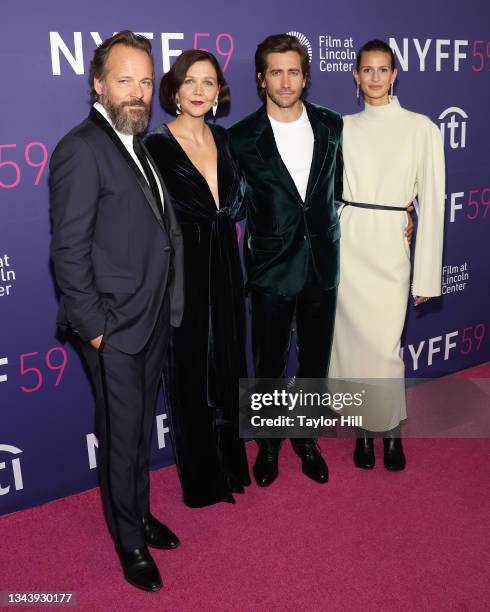 Peter Sarsgaard, Maggie Gyllenhaal, Jake Gyllenhaal, and Jeanne Cadieu attend the premiere of "The Lost Daughter" during the 2021 New York Film...