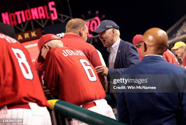 President Joe Biden visits the Republican dugout during the the Congressional Baseball game at Nationals Park September 29, 2021 in Washington, DC....