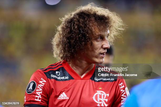 David Luiz of Flamengo leaves the pitch after suffering an injury during a semifinal second leg match between Barcelona SC and Flamengo as part of...