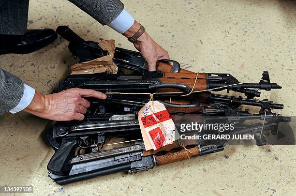 Picture taken on December 1, 2011 shows Kalachnikov guns put under seals at Marseille's court after having been seized by police during various...