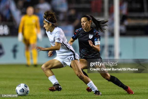 Angela Salem of the Portland Thorns FC dribbles the ball as Vanessa DiBernardo of the Chicago Red Stars defends during a game between Portland Thorns...