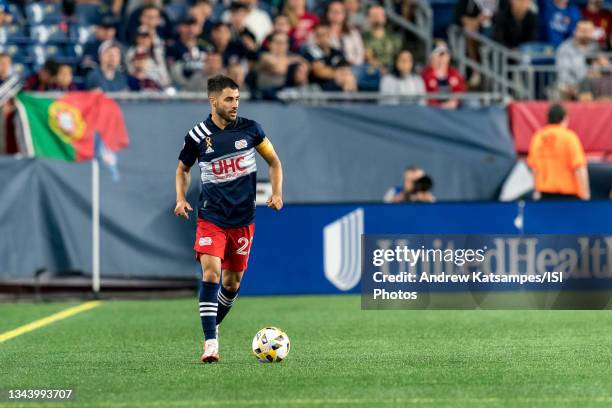 Carles Gil of New England Revolution brings the ball forward during a game between Orlando City SC and New England Revolution at Gillette Stadium on...