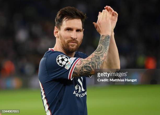 Lionel Messi of Paris Saint-Germain applauds the fans following victory in the UEFA Champions League group A match between Paris Saint-Germain and...