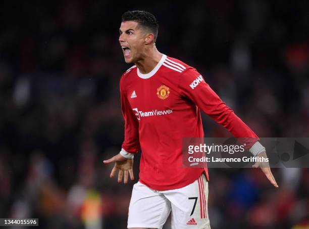 Cristiano Ronaldo of Manchester United celebrates victory on the final whistle after scoring a stoppage time winner during the UEFA Champions League...