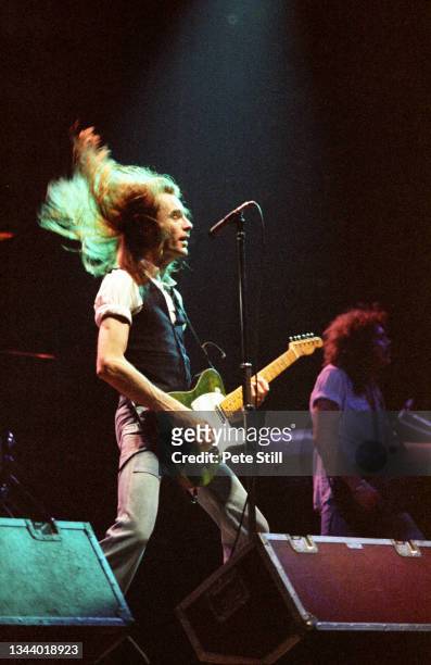 Francis Rossi and Alan Lancaster of Status Quo perform on stage at Hammersmith Odeon on June 26th, 1979 in London, United Kingdom.