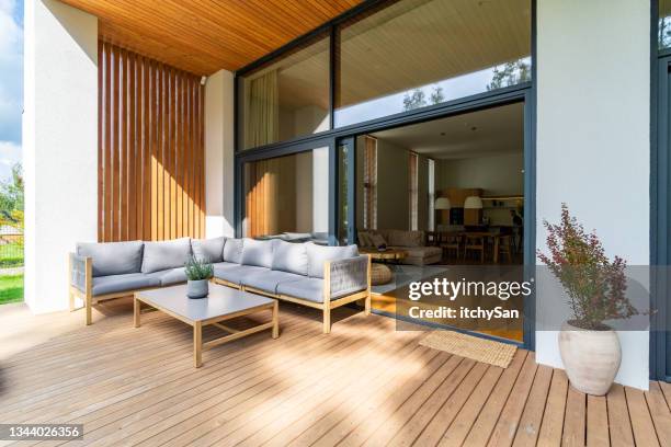 cozy patio with entrance to the house - utedäck bildbanksfoton och bilder