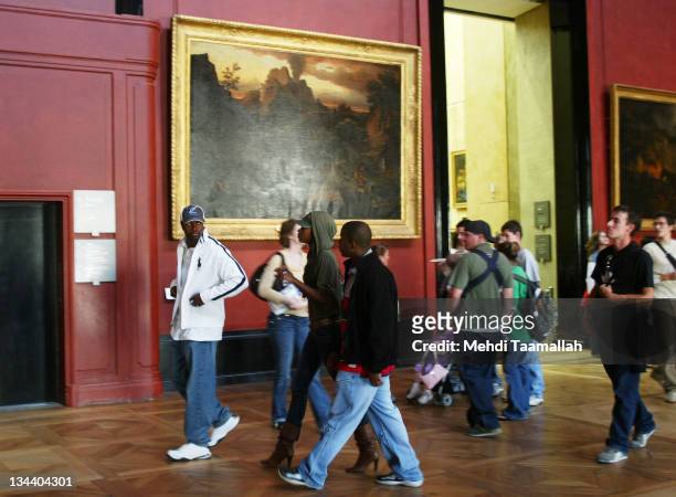 Chris Tucker and his wife Benissima during Chris Tucker Visits the Louvre - October 14, 2005 at The Louvre in Paris, France.
