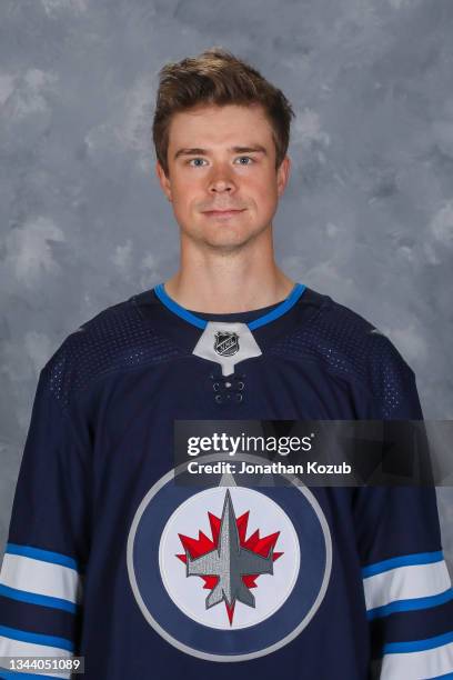 Eric Comrie of the Winnipeg Jets poses for his official headshot for the 2021-2022 season on September 22, 2021 at the Bell MTS Iceplex in Winnipeg,...