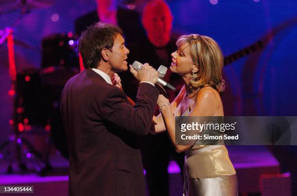 Sir Cliff Richard and Olivia Newton-John during The Royal Variety Concert - Inside and Show at The London Coliseum in London, England, Great Britain.