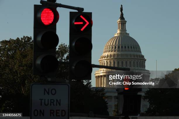 Sunrise hits the U.S. Capitol dome on September 30, 2021 in Washington, DC. Congress is facing a partial federal government shutdown at midnight if...
