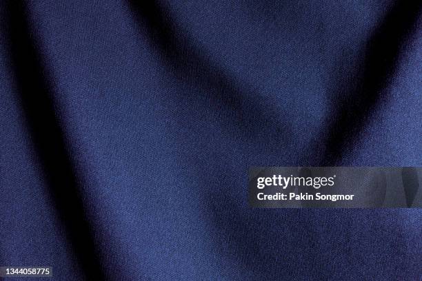 indigo color sports clothing fabric football shirt jersey texture and textile background. - jersey stock-fotos und bilder