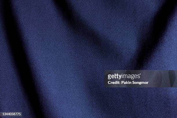 indigo color sports clothing fabric football shirt jersey texture and textile background. - dark blue background texture fotografías e imágenes de stock