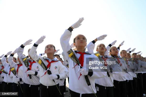 Primary school students pay tribute to martyrs at a martyr cemetery on Martyrs' Day on September 30, 2021 in Boxing County, Binzhou City, Shandong...