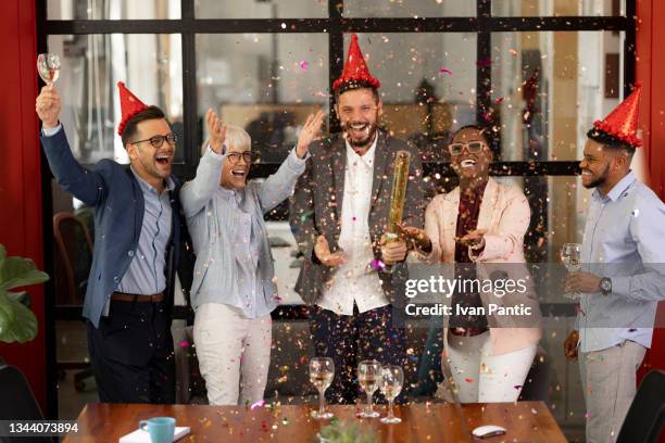 new year's eve office party - office party stock pictures, royalty-free photos & images