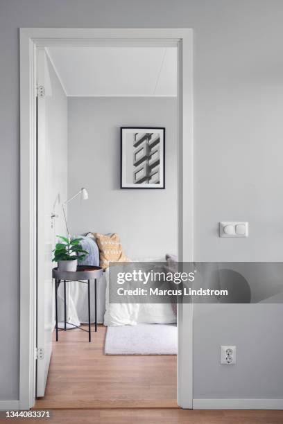 view into a modern guest room through a doorway - bedroom interior bildbanksfoton och bilder