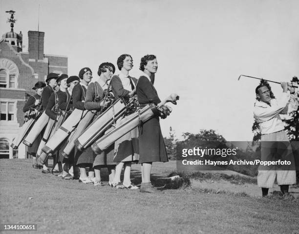 Unspecified female golfers watching British golfer Keith Dalby as he gives a lesson at Finchley Golf Club in Finchley, London, England, 14th October...
