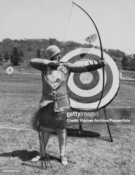 American archer Audrey Grubbs draws her bow during the 49th National Archery Association competition in Santa Barbara, California, August 1929....