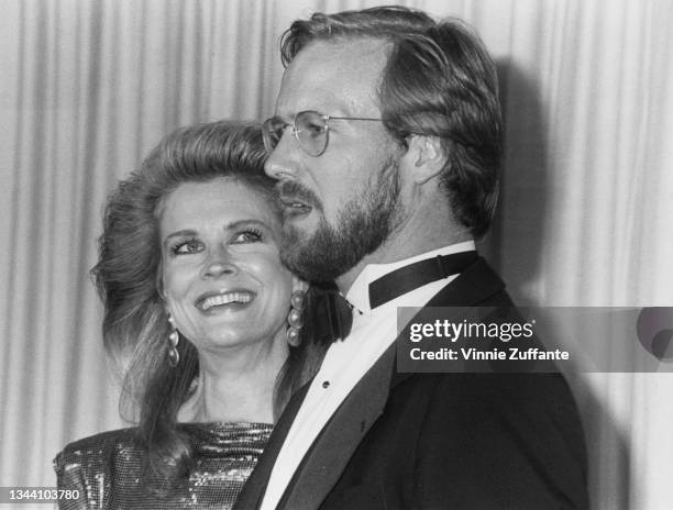 American actress Candice Bergen and American actor William Hurt in the press room at the 57th Academy Awards, held at the Dorothy Chandler Pavilion...
