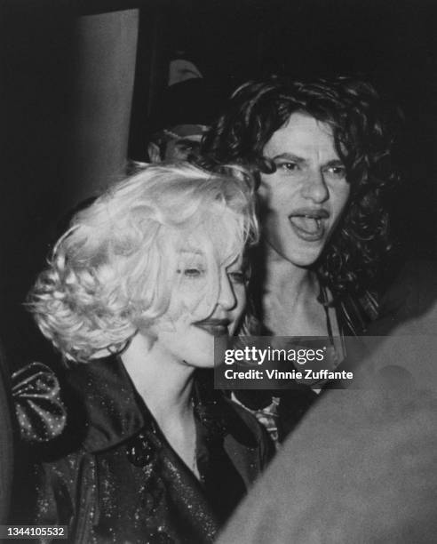 American singer-songwriter and actress Madonna and American actress and comedian Sandra Bernhard attend the album release party for Madonna's 'Like a...