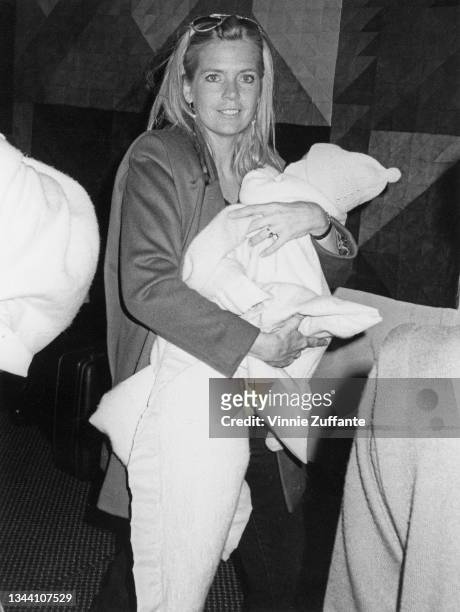 American actress Meredith Baxter Birney holding one of her twins during rehearsals for the 'Night of 100 Stars' at the New York Hilton Hotel in New...