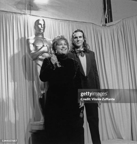 American actress Kathy Bates and British actor Daniel Day-Lewis in the press room of the 63rd Academy Awards, held at the Shrine Auditorium in Los...