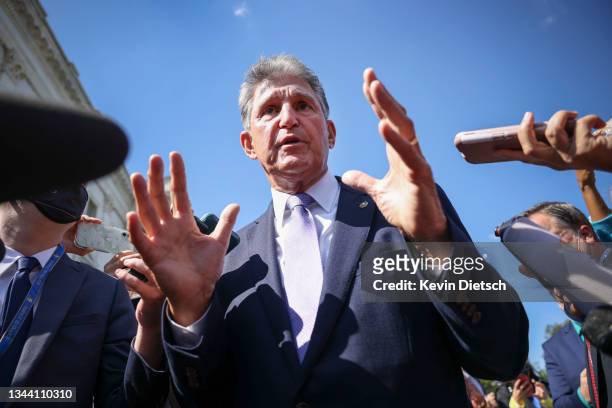 Sen. Joe Manchin speaks to reporters outside of the U.S. Capitol on September 30, 2021 in Washington, DC. The Senate is expected to pass a short term...